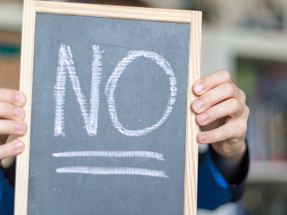 Chalkboard that says, "No" on it.